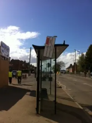 Image courtesy of Scott Kennedy-Lount, Leicester City Liberal Democrats Loose Bus Stop Sign outside Holy Cross Primary School, Eyres Monsell Ward